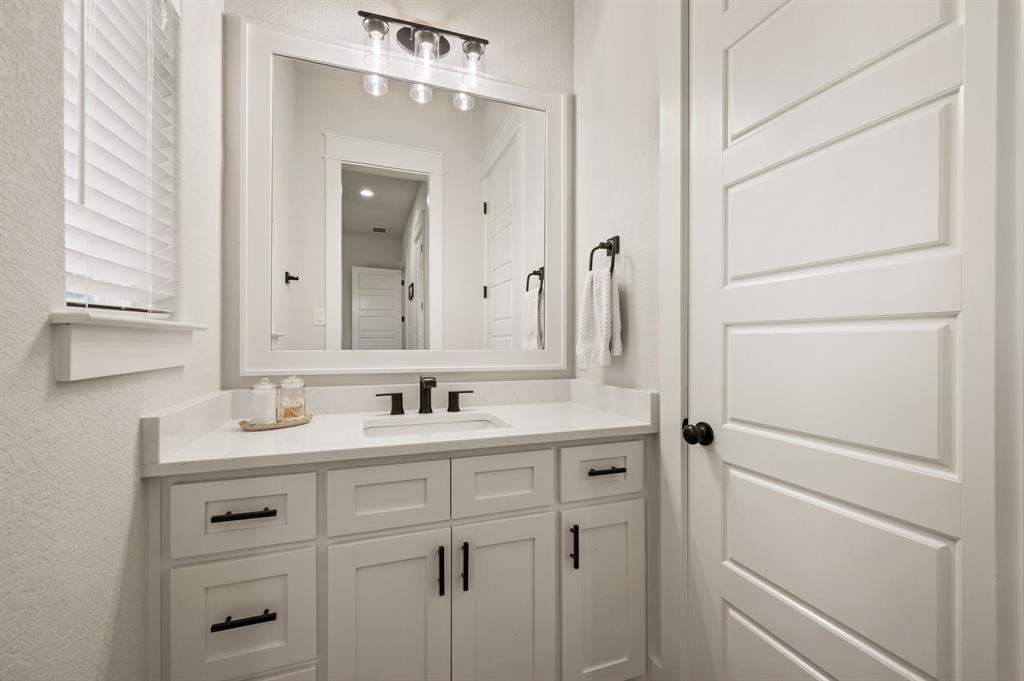 200 Clayton Crossing Springtown, TX 76082 - Photo 27 of 40 a bathroom with a sink and a mirror