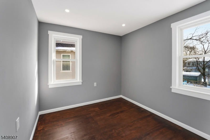 209 Vine Street Delanco, NJ 08075 - Photo 21 of 43 a view of empty room with wooden floor and fan