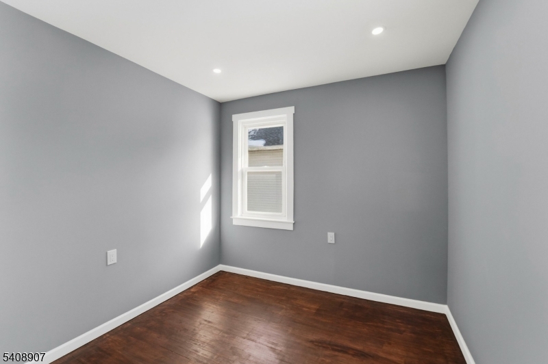 209 Vine Street Delanco, NJ 08075 - Photo 22 of 43 an empty room with wooden floor and windows