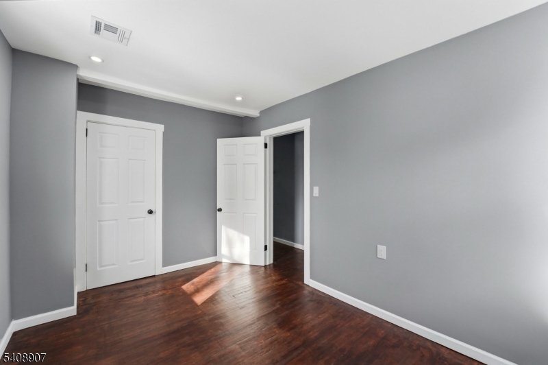 209 Vine Street Delanco, NJ 08075 - Photo 23 of 43 a view of an empty room with wooden floor
