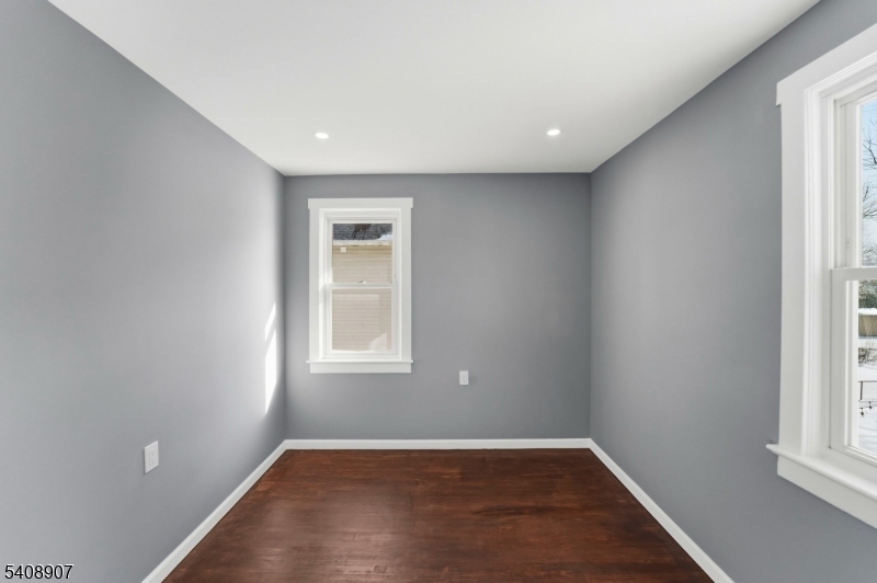 209 Vine Street Delanco, NJ 08075 - Photo 31 of 43 an empty room with wooden floor and windows