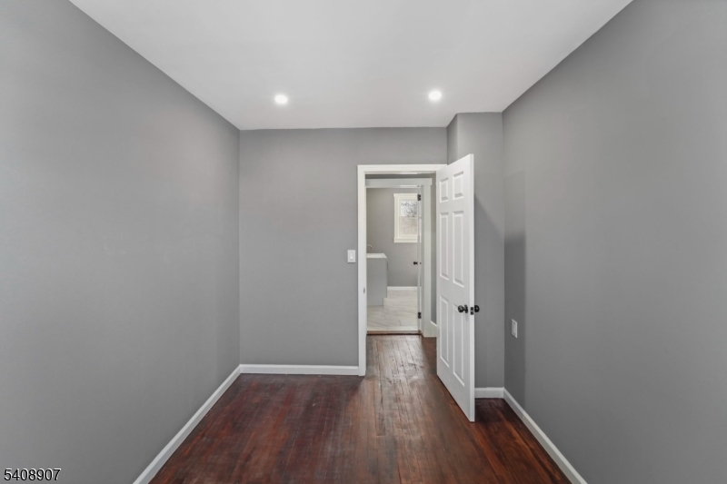 209 Vine Street Delanco, NJ 08075 - Photo 33 of 43 a view of a hallway with wooden floor