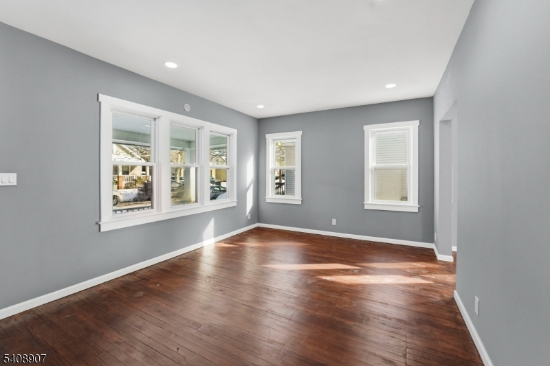 209 Vine Street Delanco, NJ 08075 - Photo 5 of 43 an empty room with wooden floor and windows