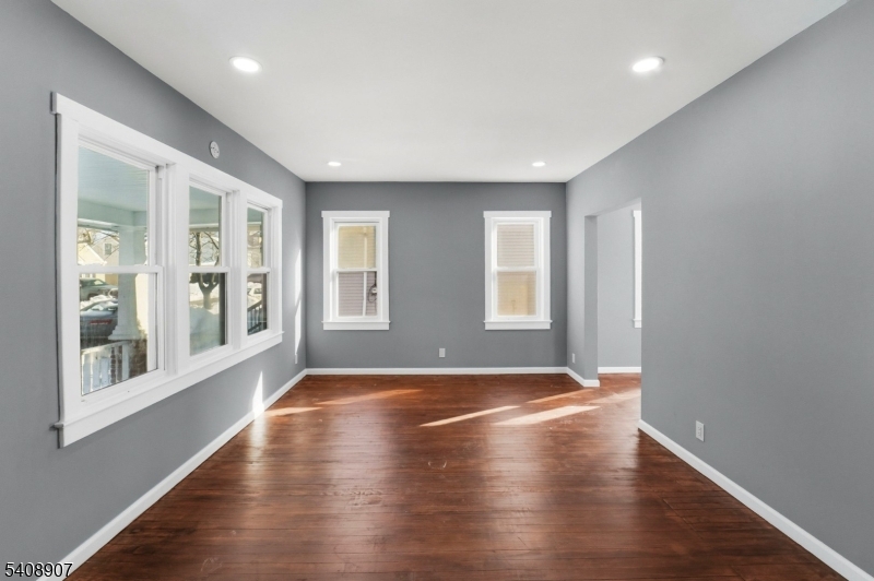 209 Vine Street Delanco, NJ 08075 - Photo 6 of 43 a view of an empty room with wooden floor and a window