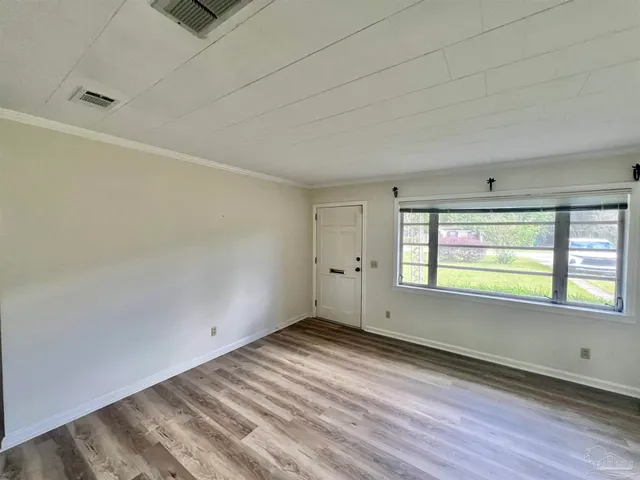 a view of an empty room and window