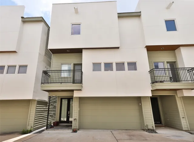 a front view of a building with garage