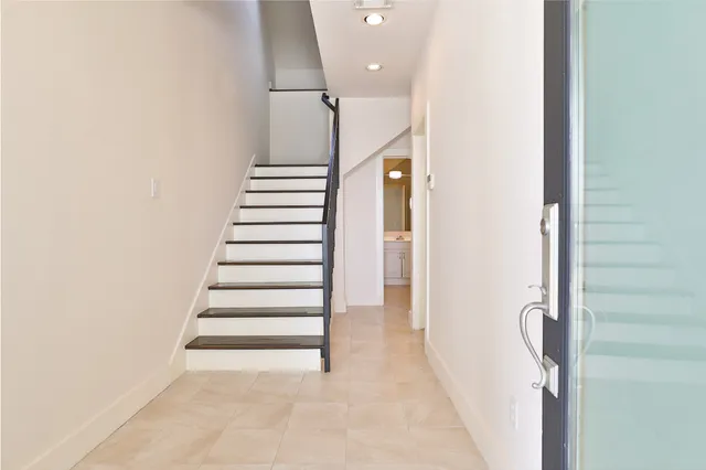 a view of entryway with stairs and wooden floor