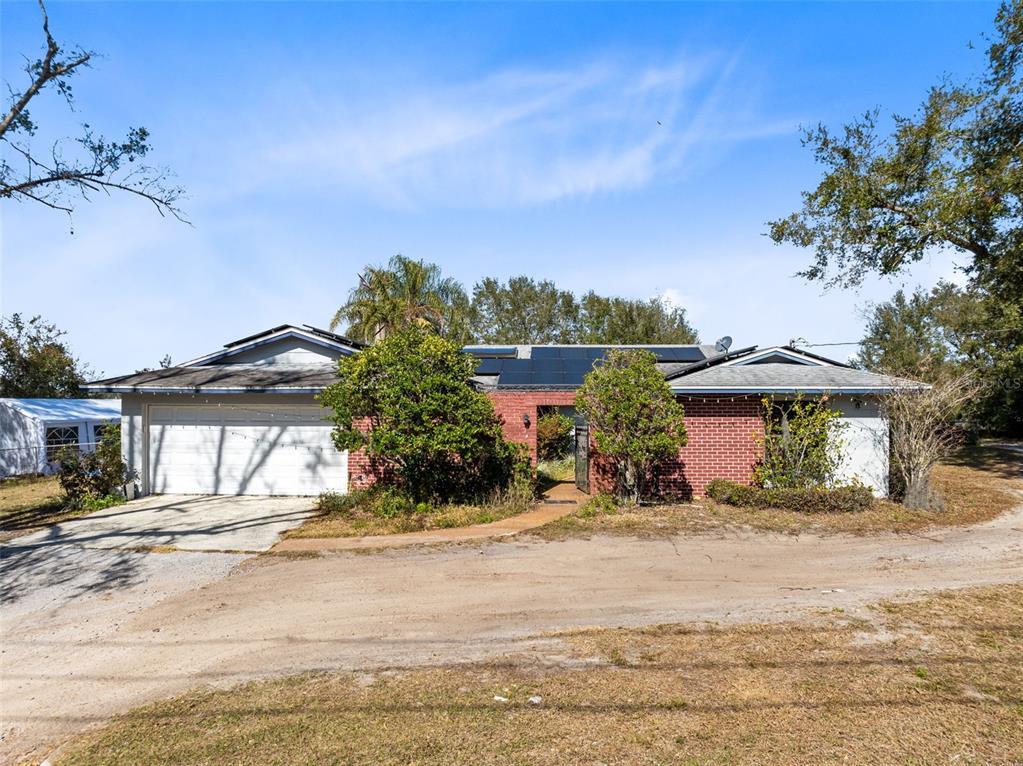 4023 West Ponkan Road Apopka, FL 32712 - Photo 1 of 1 a front view of a house with a yard