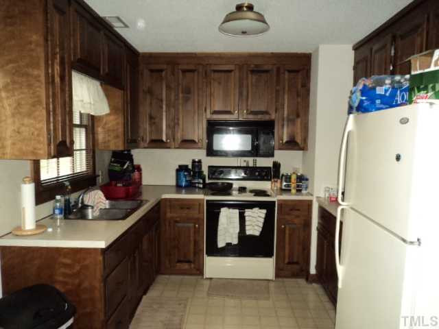 907 Pebblebrook Drive Raleigh, NC 27609 - Photo 23 of 25 The suite/apartment kitchen has full size oven, microwave, refrigerator & dbl sink. Closet in kitchen houses washer & dryer. Current dryer is electric, previous dryer was gas, so gas is available right at the dryer. All appliances in the suite convey. Apartment