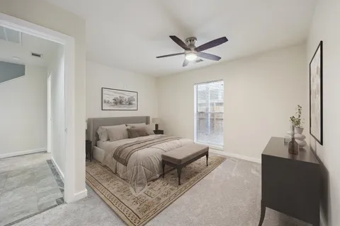 a bedroom with a large bed and a window