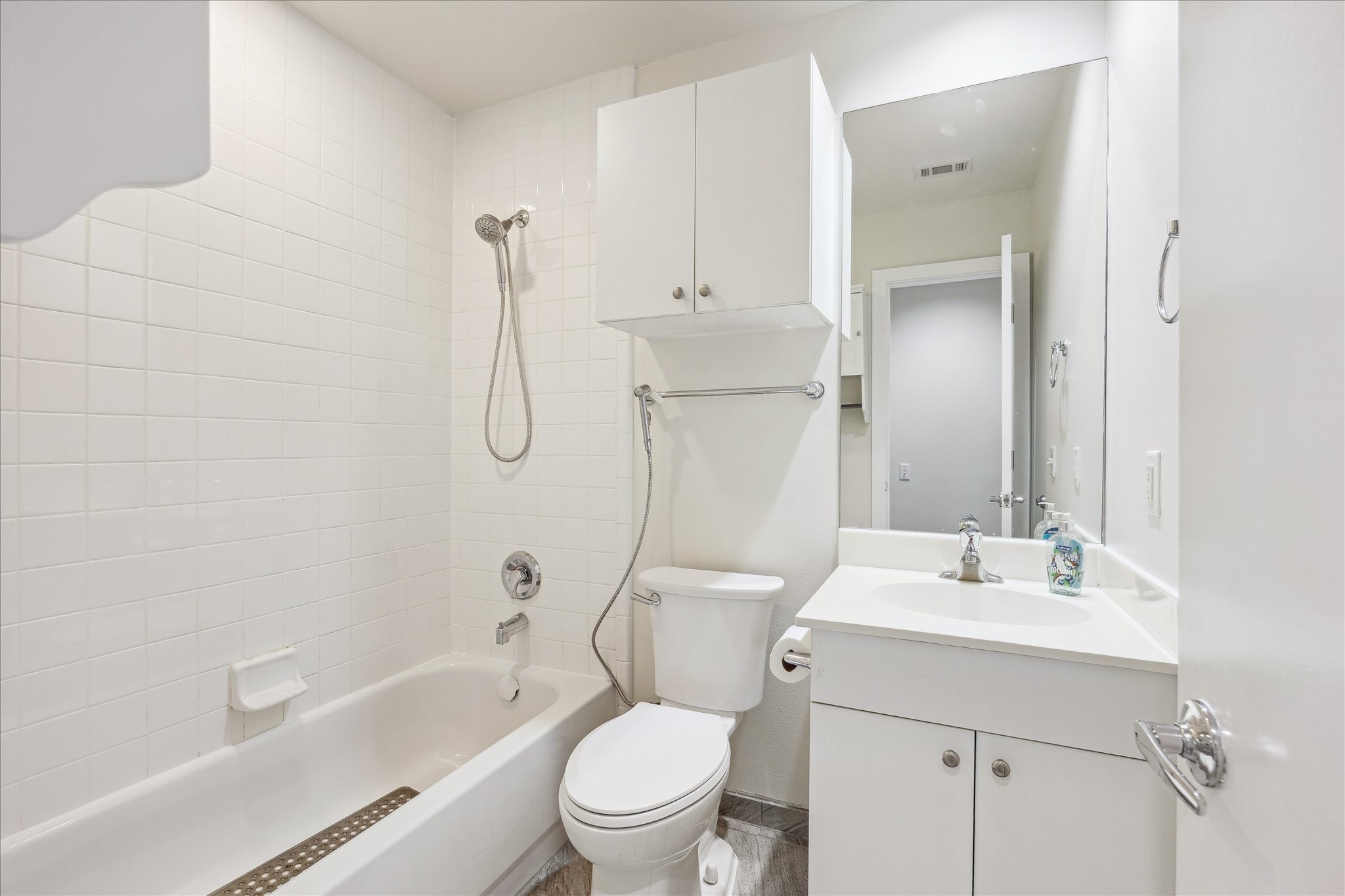 1617 Tuam Street Houston, TX 77004 - Photo 24 of 35 Bright and functional secondary bathroom with a tub/shower combination, perfect for family or guests.