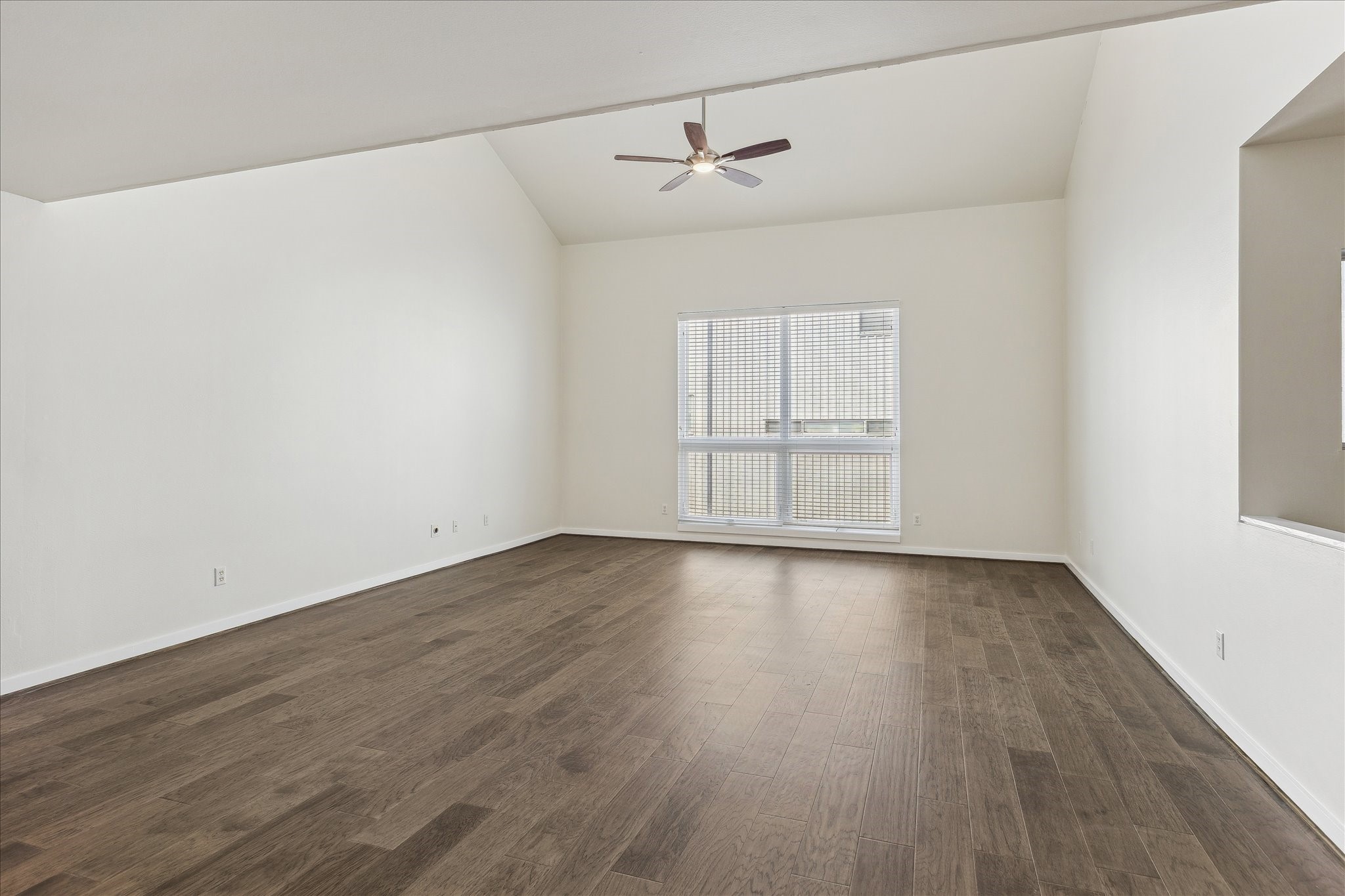 1617 Tuam Street Houston, TX 77004 - Photo 10 of 35 an empty room with wooden floor and windows
