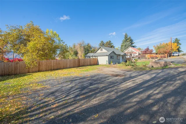 an aerial view of residential houses with yard