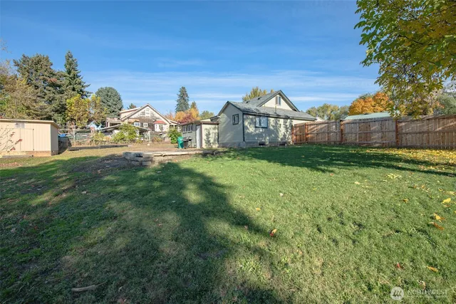a view of a big yard next to a house