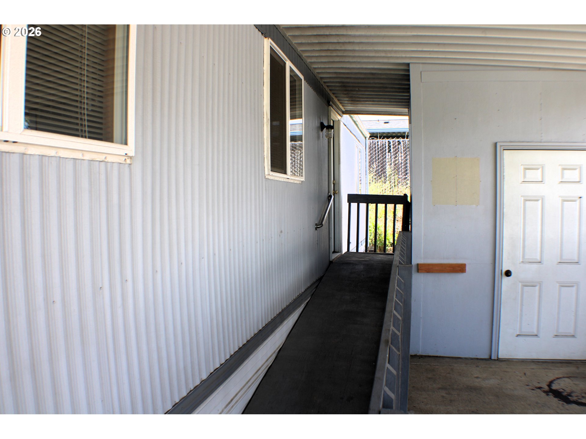 228 Estate Loop Winston, OR 97496 - Photo 6 of 19 a view of a porch with wooden floor