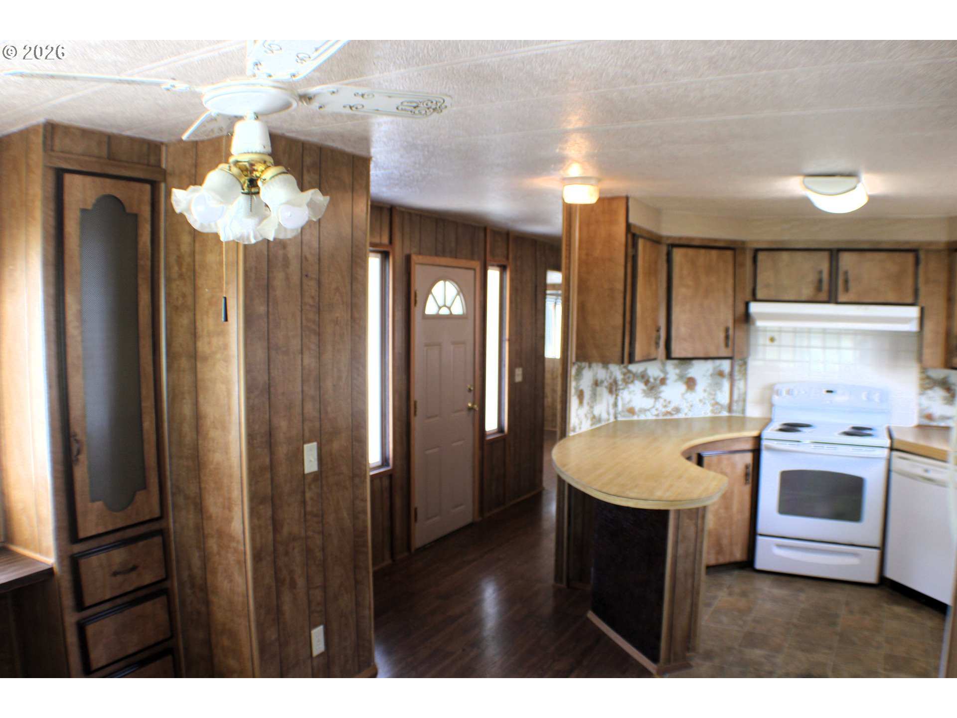228 Estate Loop Winston, OR 97496 - Photo 10 of 19 a kitchen with a sink and a refrigerator