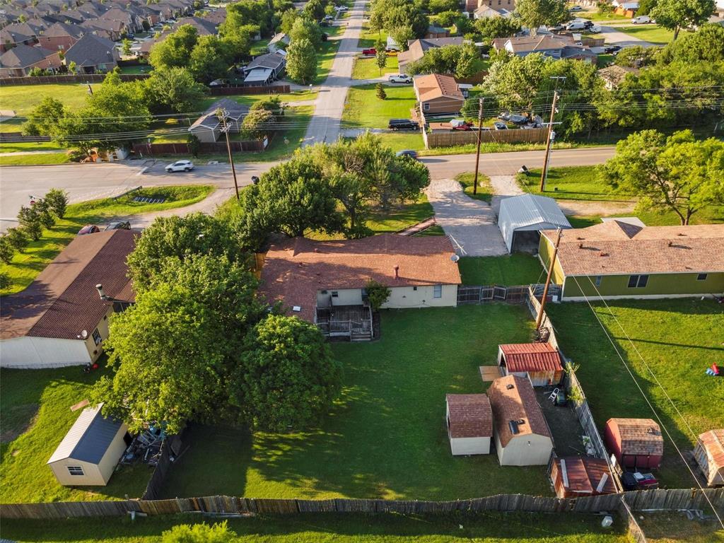 an aerial view of a house with a garden and swimming pool