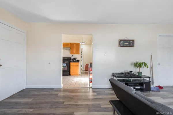 a kitchen with granite countertop a stove and a wooden floors