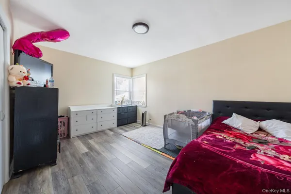 a bedroom with bed and window