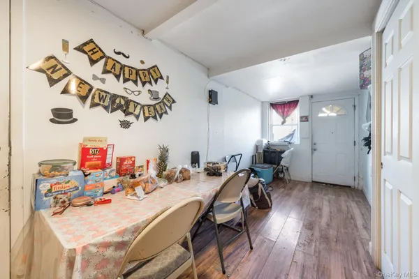 a view of a dining area with furniture and wooden floor