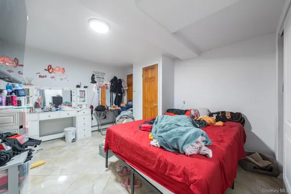 a bedroom with a bed and cabinets