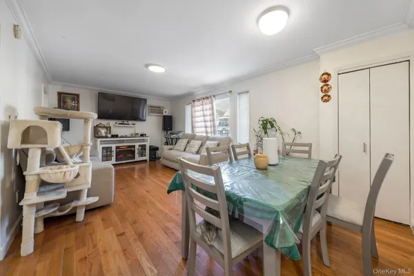 a view of a dining room with furniture and wooden floor