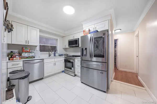 a kitchen with stainless steel appliances cabinets a sink and a counter top space