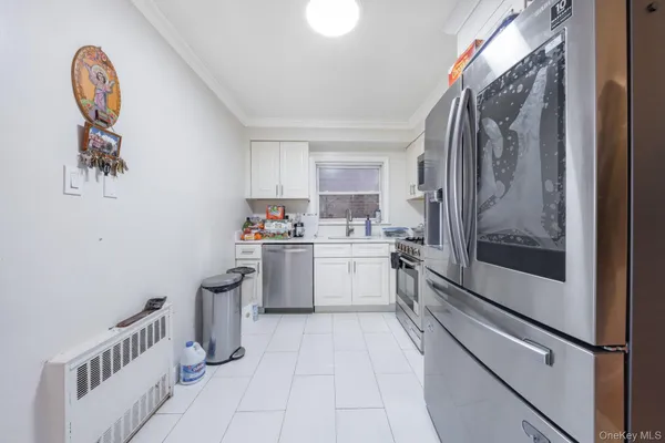 a kitchen with a refrigerator and a sink