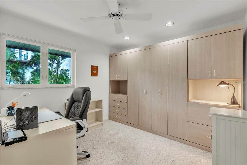 103 Sunset Lane Anna Maria, FL 34217 - Photo 13 of 53 a view of a workspace with furniture and a window