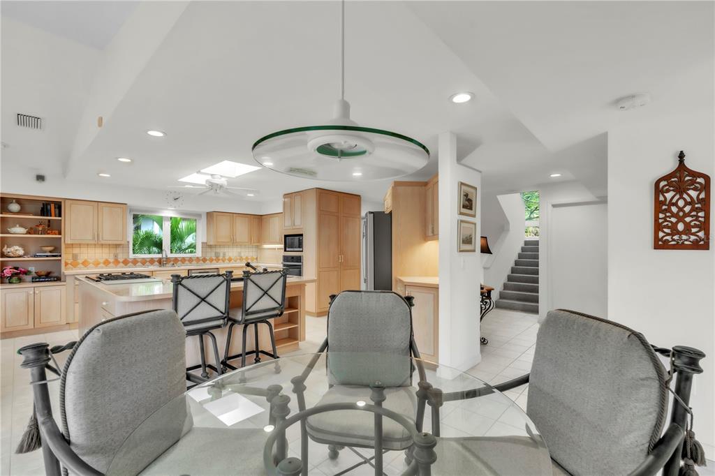 103 Sunset Lane Anna Maria, FL 34217 - Photo 22 of 54 a view of a dining room with furniture