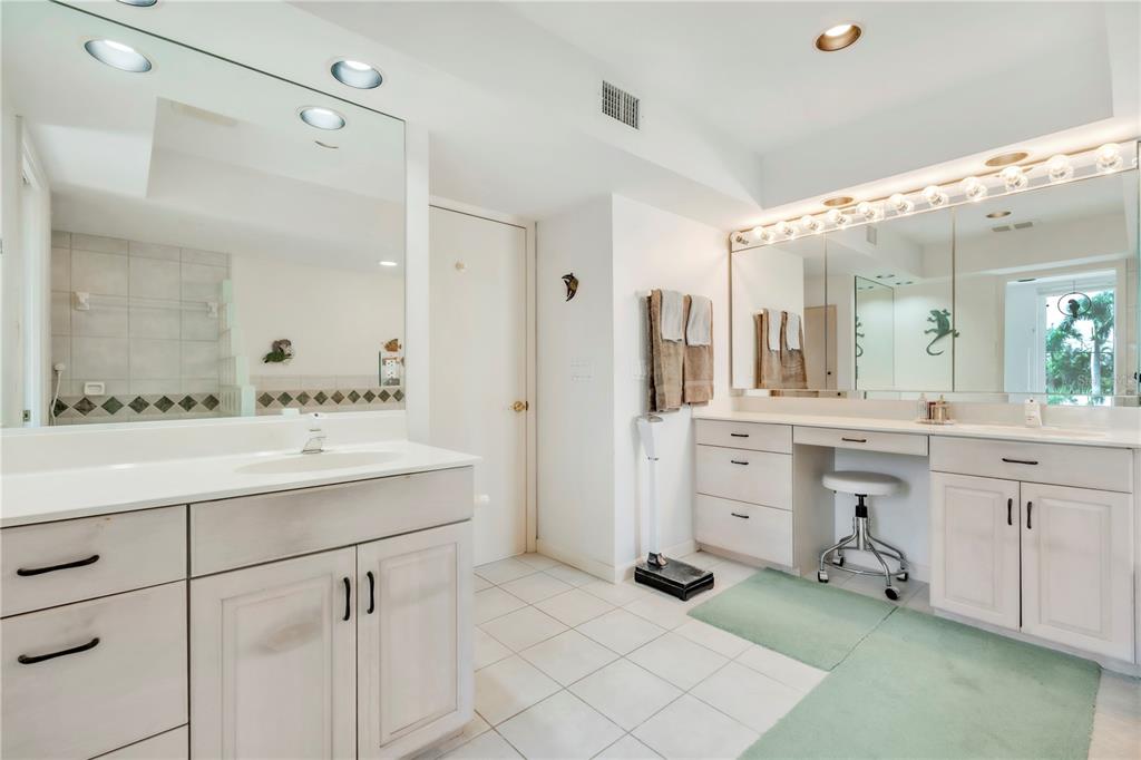 103 Sunset Lane Anna Maria, FL 34217 - Photo 34 of 53 a spacious bathroom with a granite countertop sink mirror and a