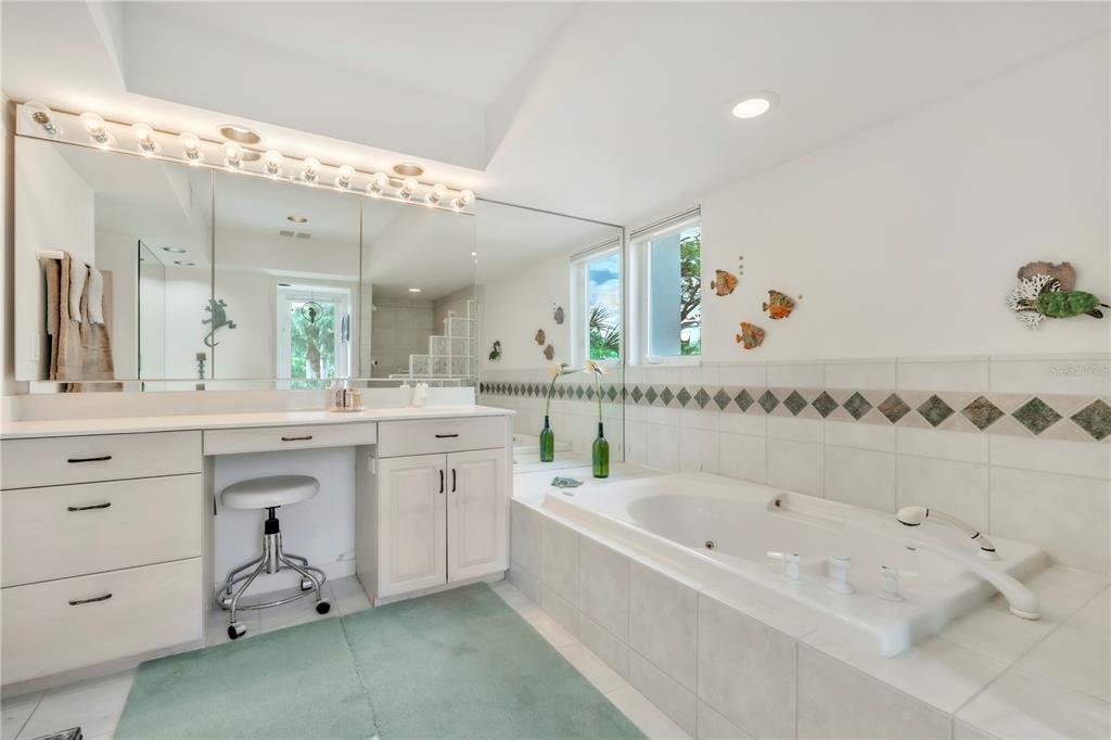 103 Sunset Lane Anna Maria, FL 34217 - Photo 34 of 54 a bathroom with a bathtub and a sink