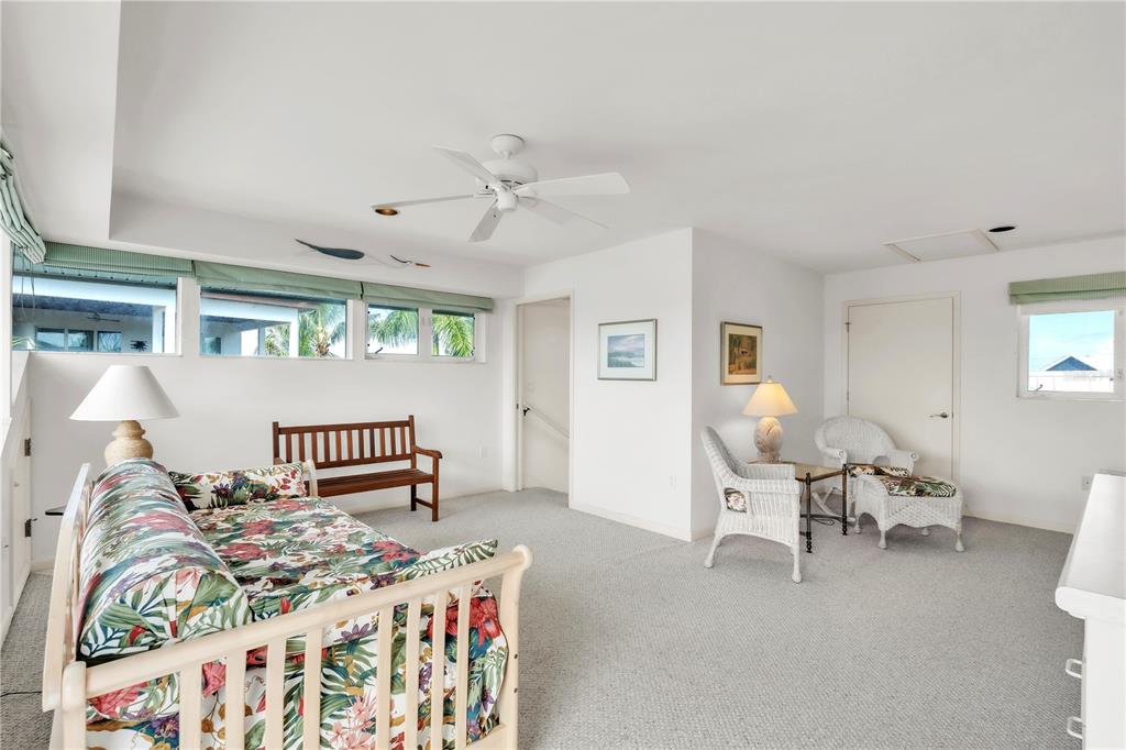 103 Sunset Lane Anna Maria, FL 34217 - Photo 38 of 54 a bedroom with furniture and a window