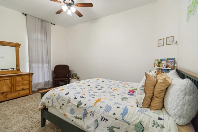 a bedroom with bed and furniture