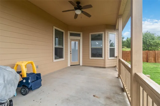 an aerial view of multiple houses with yard