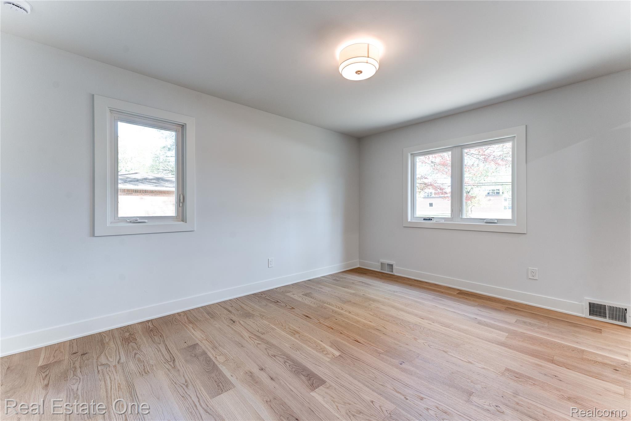 786 South Cranbrook Road Bloomfield Hills, MI 48301 - Photo 22 of 38 Unfurnished room with light wood finished floors and healthy amount of natural light