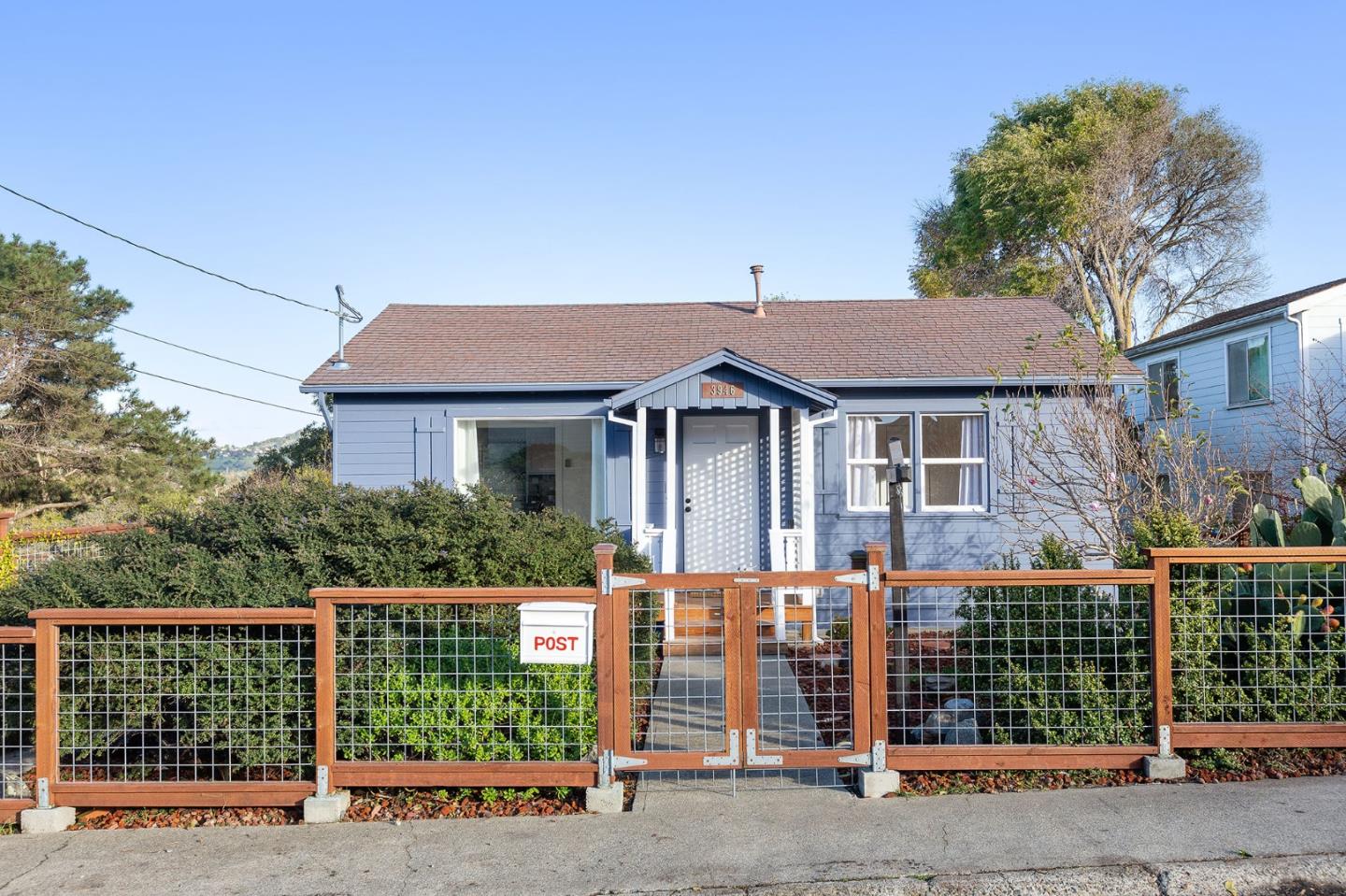 3946 La Colina Road El Sobrante, CA 94803 - Photo 2 of 49 a front view of a house with a garden