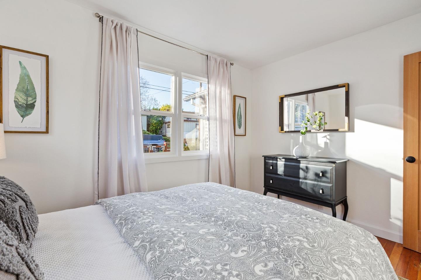 3946 La Colina Road El Sobrante, CA 94803 - Photo 15 of 49 a bedroom with a bed and wooden floor
