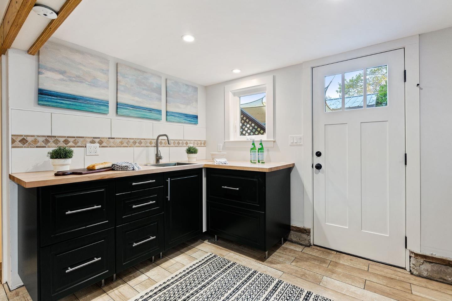 3946 La Colina Road El Sobrante, CA 94803 - Photo 28 of 49 a kitchen with a sink and cabinets