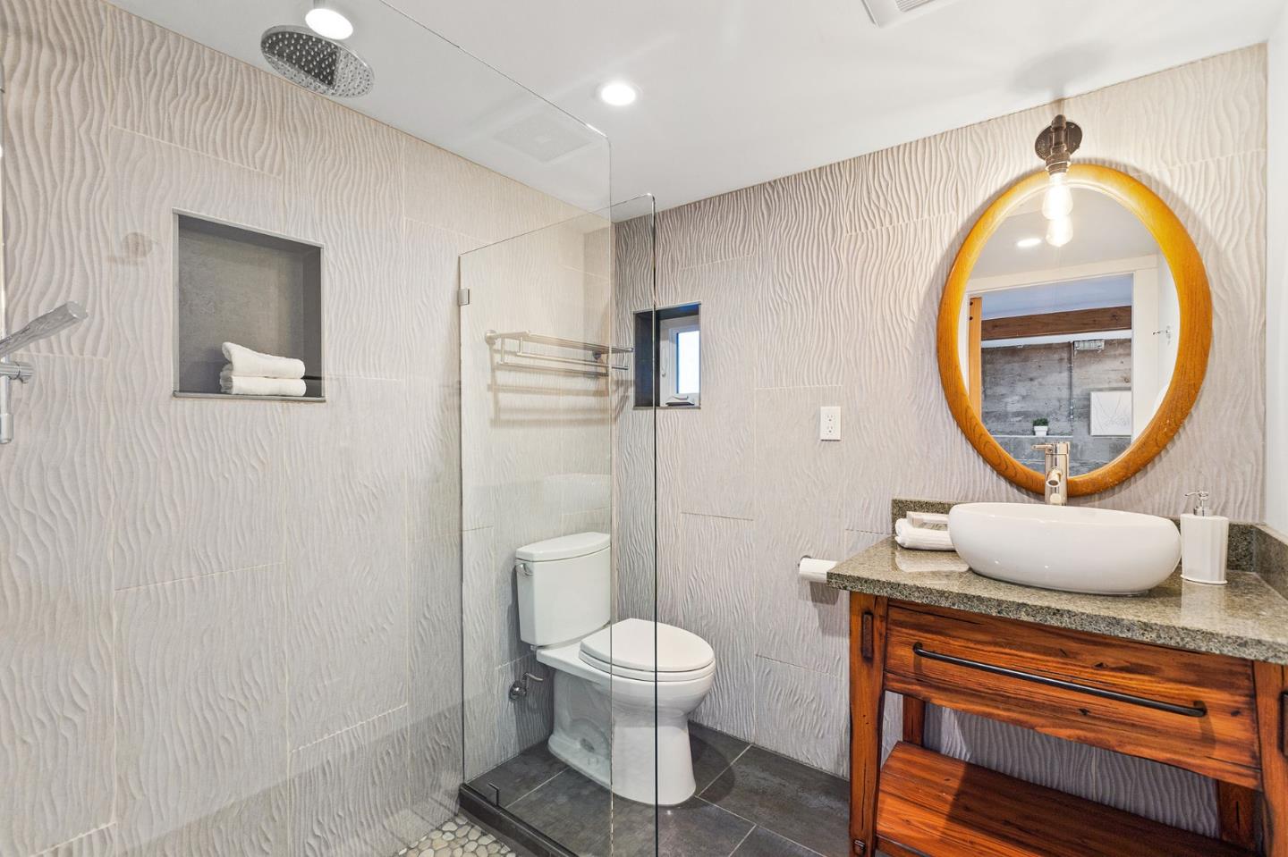 3946 La Colina Road El Sobrante, CA 94803 - Photo 33 of 49 a bathroom with a toilet a sink and a mirror