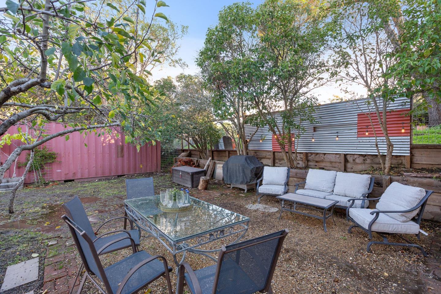 3946 La Colina Road El Sobrante, CA 94803 - Photo 44 of 49 a backyard of a house with barbeque oven table and chairs