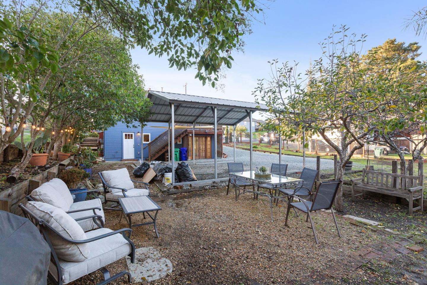 3946 La Colina Road El Sobrante, CA 94803 - Photo 45 of 49 a view of a patio with table and chairs and potted plants