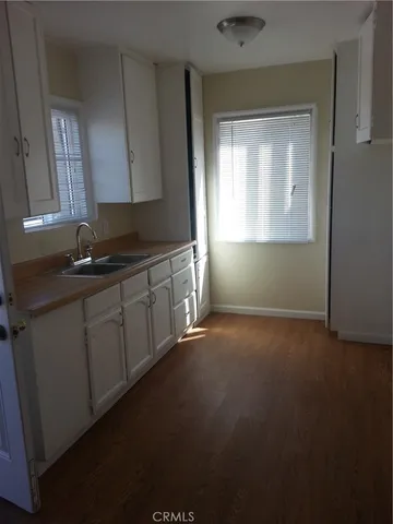 a kitchen with a sink and cabinets