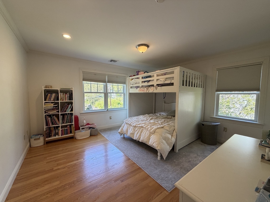 65 Denton Road Wellesley, MA 02482 - Photo 10 of 16 a bedroom with a bed and a window