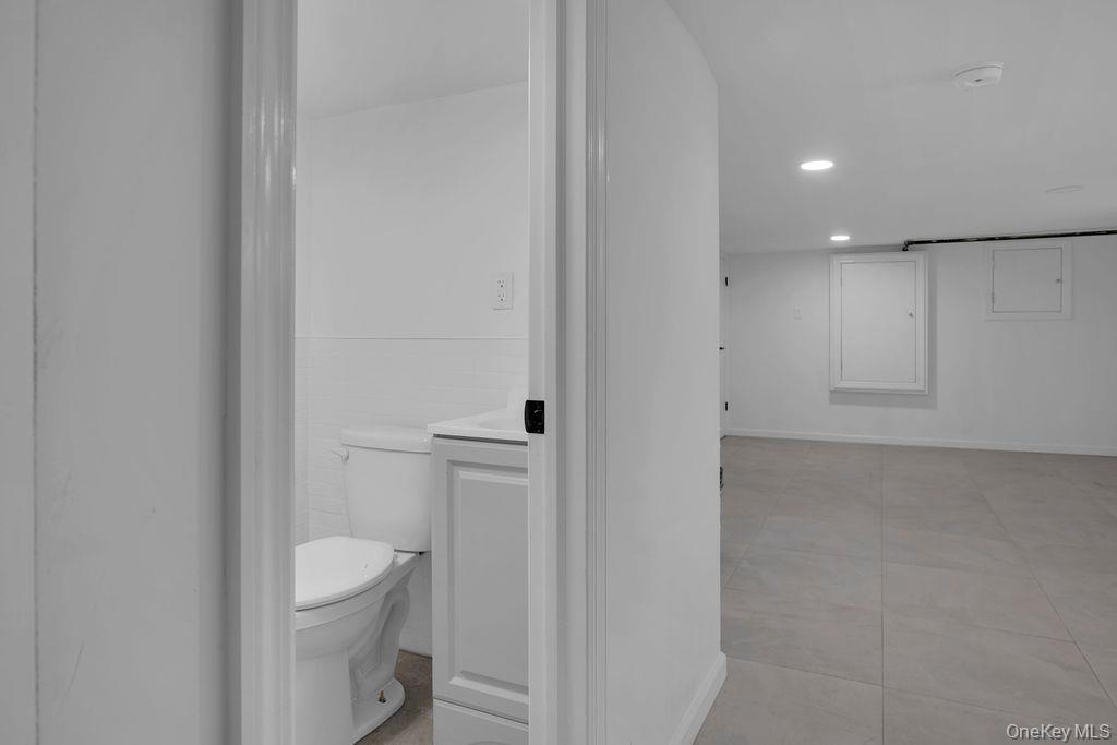 173-62 103rd Road Queens, NY 11433 - Photo 20 of 23 a bathroom with a toilet