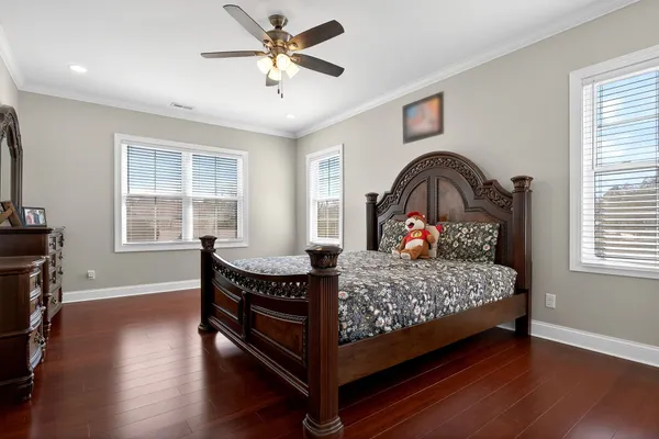 a bedroom with a bed and window