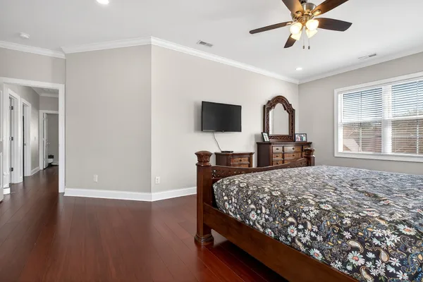 a bedroom with a bed and a dresser