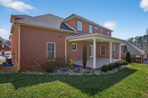 a bedroom with furniture and a flat screen tv