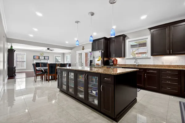 a kitchen with a sink stove and cabinets