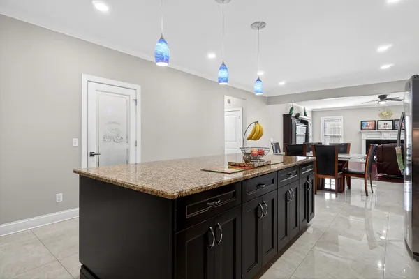 a kitchen with stainless steel appliances granite countertop a sink stove and cabinets